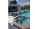 Enjoy this large pool with a spa and covered lanai perfect for entertaining at 881 Bayshore Dr, Englewood, FL 34223