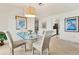 Dining area with glass-top table and seating for four at 101 Pebble Rock Dr, Venice, FL 34293