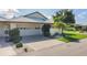 Charming single-story home with well-manicured landscaping and a two-car garage at 101 Pebble Rock Dr, Venice, FL 34293