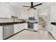 Modern kitchen with stainless steel appliances and white cabinetry at 101 Pebble Rock Dr, Venice, FL 34293