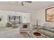 Living room with bay window, beige couches, and a coffee table at 101 Pebble Rock Dr, Venice, FL 34293