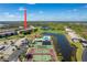 Aerial view showing community pool, tennis courts, and building location at 175 Kings Hwy # 233, Punta Gorda, FL 33983