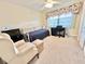 Cozy bedroom with a daybed, desk, and ample natural light at 175 Kings Hwy # 233, Punta Gorda, FL 33983