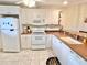 Bright kitchen with white cabinets, and a double sink at 175 Kings Hwy # 233, Punta Gorda, FL 33983