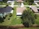 Aerial view of house, backyard, and surrounding neighborhood at 35 Mark Twain Ln, Rotonda West, FL 33947