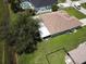 Aerial view of house, backyard, and surrounding neighborhood at 35 Mark Twain Ln, Rotonda West, FL 33947