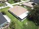 Aerial view showing house, backyard and screened enclosure at 35 Mark Twain Ln, Rotonda West, FL 33947