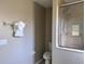 Bathroom with shower, toilet and a place for towels at 35 Mark Twain Ln, Rotonda West, FL 33947