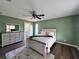 Spacious bedroom with a ceiling fan and wood-look floors at 35 Mark Twain Ln, Rotonda West, FL 33947