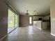 Bright dining room with tile flooring and access to the kitchen at 35 Mark Twain Ln, Rotonda West, FL 33947