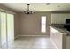 Simple dining room with tile floors and a sliding glass door at 35 Mark Twain Ln, Rotonda West, FL 33947