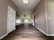 Spacious entryway with hardwood floors and chandelier at 35 Mark Twain Ln, Rotonda West, FL 33947