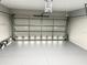 Clean and spacious garage with automatic garage door opener at 35 Mark Twain Ln, Rotonda West, FL 33947