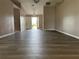 Large living room with hardwood floors and an open floor plan at 35 Mark Twain Ln, Rotonda West, FL 33947