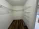 Spacious walk-in closet with wire shelving and hanging rods at 35 Mark Twain Ln, Rotonda West, FL 33947