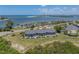 Aerial view of waterfront property with multiple buildings and parking at 6000 Boca Grande Cswy # D46, Boca Grande, FL 33921