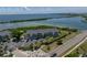 Aerial view of waterfront property with parking and lush landscaping at 6000 Boca Grande Cswy # D46, Boca Grande, FL 33921