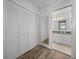 Bathroom with white cabinets and a large mirror at 6000 Boca Grande Cswy # D46, Boca Grande, FL 33921