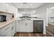 Modern white kitchen with quartz countertops and stainless steel appliances at 6000 Boca Grande Cswy # D46, Boca Grande, FL 33921