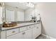 Well-lit bathroom with single vanity and granite countertop at 7537 Pool Compass Loop, Wesley Chapel, FL 33545