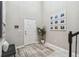 Entryway with bench, rug, and framed pictures at 7537 Pool Compass Loop, Wesley Chapel, FL 33545