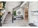 Bright and spacious entryway with staircase and console table at 7537 Pool Compass Loop, Wesley Chapel, FL 33545