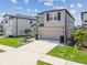 Two-story house with landscaping and two-car garage at 7537 Pool Compass Loop, Wesley Chapel, FL 33545