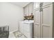 Convenient laundry room with washer, dryer, and ample storage at 7537 Pool Compass Loop, Wesley Chapel, FL 33545