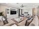 Comfortable living room showcasing neutral tones, built-in shelving, and ample seating at 7537 Pool Compass Loop, Wesley Chapel, FL 33545