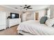 Bright main bedroom with white dresser and large bed, offering ample space at 7537 Pool Compass Loop, Wesley Chapel, FL 33545