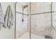 Large walk-in shower with neutral tile and double shower heads at 7537 Pool Compass Loop, Wesley Chapel, FL 33545