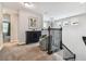 Upstairs hallway with seating area and view of the staircase at 7537 Pool Compass Loop, Wesley Chapel, FL 33545