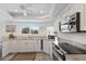 Bright kitchen featuring stainless steel appliances, granite countertops, and a window at 11000 Placida Rd # 2303, Placida, FL 33946