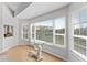 Bright sitting area with unique glass desk in front of window with water views at 11000 Placida Rd # 2303, Placida, FL 33946