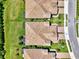 Aerial view of the neighborhood highlighting lush landscaping and well-maintained properties at 26950 Pavin Dr, Englewood, FL 34223
