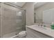 Bathroom featuring a glass shower, toilet, vanity with a white countertop at 26950 Pavin Dr, Englewood, FL 34223