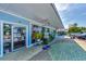 Charming storefront with eye-catching signage and vibrant displays offering a unique shopping experience along a landscaped walkway at 26950 Pavin Dr, Englewood, FL 34223