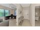 Inviting foyer showcasing an office space, neutral tile flooring, and serene decor at 26950 Pavin Dr, Englewood, FL 34223