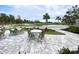 Picturesque view of the golf course from an outdoor seating area at 26950 Pavin Dr, Englewood, FL 34223