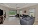Spacious living room with large sliding doors to the lanai and recessed lighting at 26950 Pavin Dr, Englewood, FL 34223