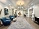 Spacious lobby area with hardwood floors, elegant furnishings, and stylish decor at 26950 Pavin Dr, Englewood, FL 34223