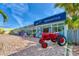 The Walter Green Mercantile storefront features a red tractor and brick walkway at 26950 Pavin Dr, Englewood, FL 34223