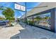 Exterior of commercial buildings with various retail storefronts and pedestrian walkway at 26950 Pavin Dr, Englewood, FL 34223