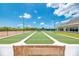 Well-maintained bocce ball courts with a wooden bench at 3363 Grand Vista Ct # 203, Port Charlotte, FL 33953