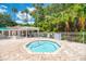 Octagonal shaped community hot tub with surrounding lounge chairs at 3363 Grand Vista Ct # 203, Port Charlotte, FL 33953