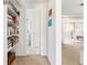 Hallway with built-in shelves and access to other rooms at 1115 Larchmont Dr, Englewood, FL 34223