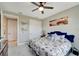 Bedroom with queen bed, and access to a hallway at 1337 Sorrell Way, North Port, FL 34289