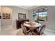 Elegant dining area with wood table and chairs, marble flooring at 1337 Sorrell Way, North Port, FL 34289