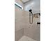 Walk-in shower with modern fixtures and built-in shelving at 1337 Sorrell Way, North Port, FL 34289