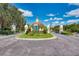 Gated entrance to the community with landscaping and signage at 1384 Backspin Dr, Englewood, FL 34223